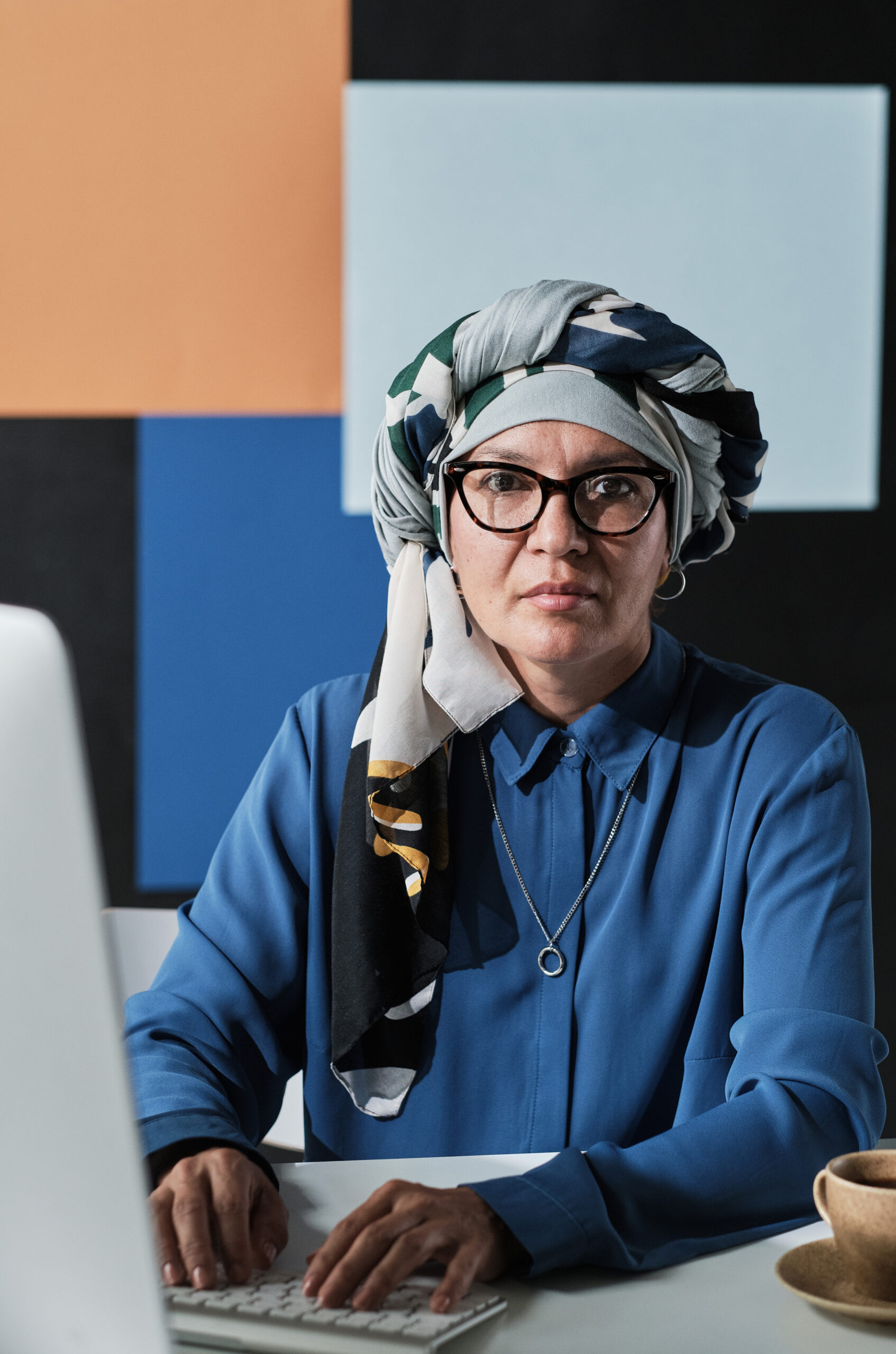 muslim businesswoman typing on computer hzyxd5f scaled.jpg